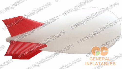 White Blimp with red fins